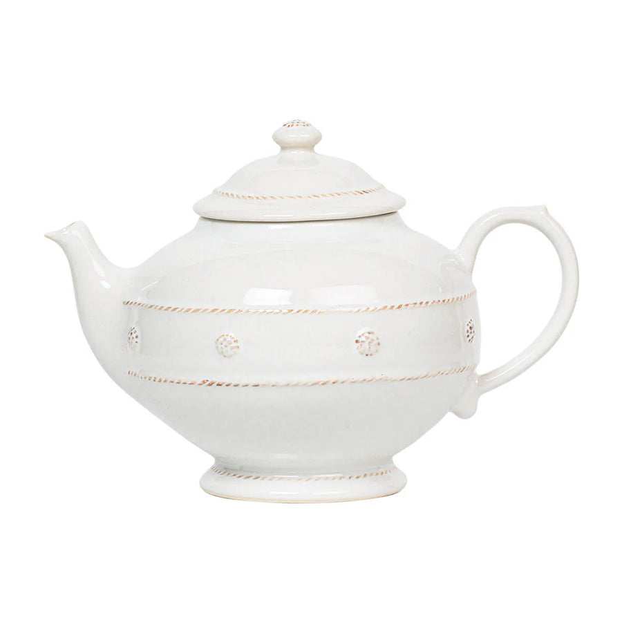 White ceramic teapot with a round body, intricate berry and thread detailing, and a matching lid.