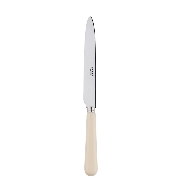 Sabre Paris Pop Unis dinner knife with a sleek stainless steel blade and a cream-colored handle.