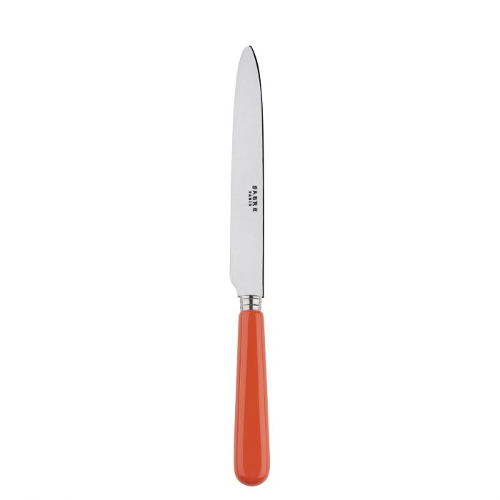 Sabre Paris Pop Unis dinner knife with a sleek stainless steel blade and a vibrant orange handle.