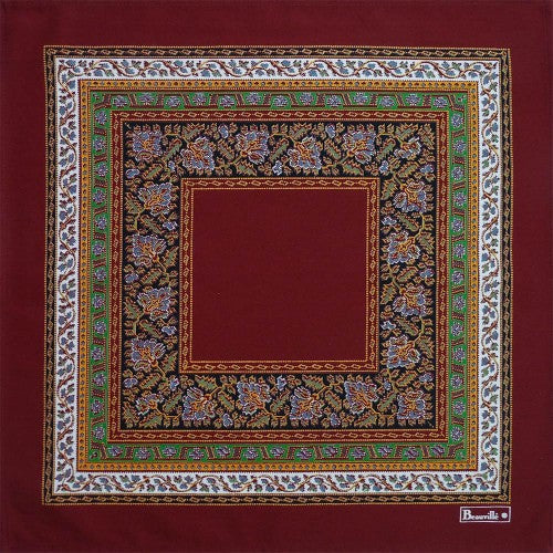 Beauville Feuilles de Vigne red napkin featuring intricate floral patterns and a decorative border.