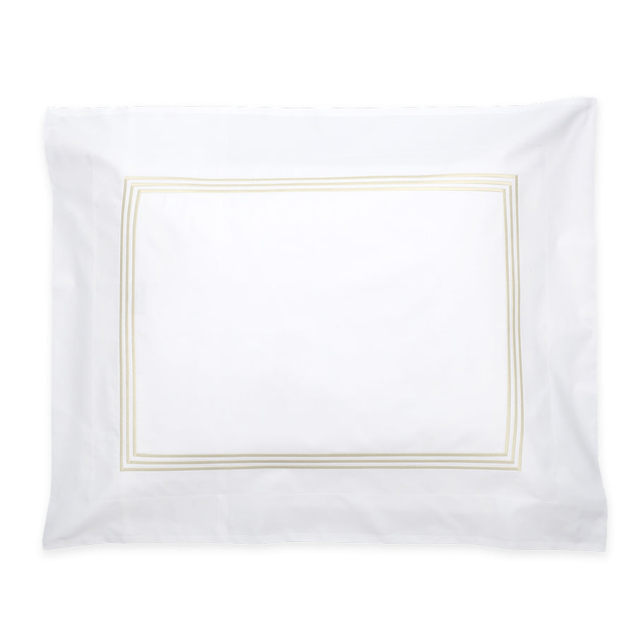 Matouk Bel Tempo Pillow Sham featuring a crisp white fabric with a subtle gold border design.