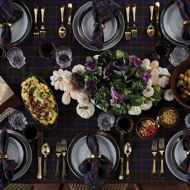 Elegant table setting featuring Juliska Pewter Stoneware Footed Soup Bowl among festive decor and seasonal dishes.