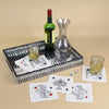 Set of 8 Kim Seybert House of Cards cocktail napkins displayed on a tray with drinks, a carafe, and dice.