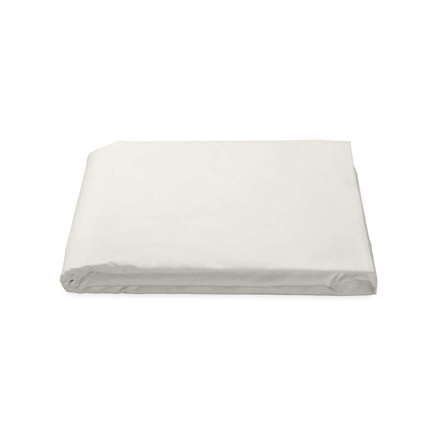 Matouk Luca fitted sheet in a soft cream color, neatly folded and showcasing a smooth, high-quality fabric.