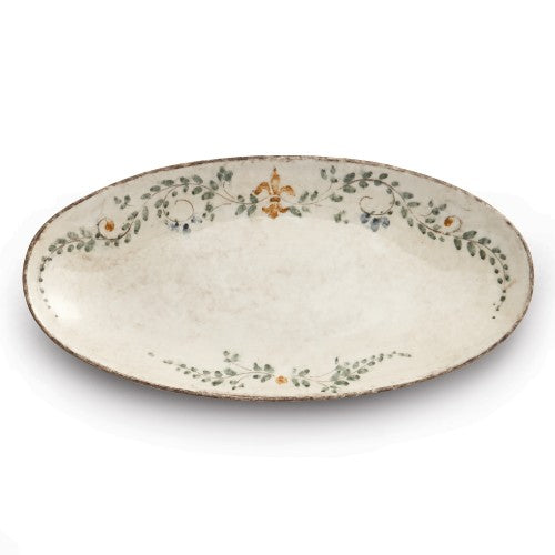 Arte Italica Medici oval platter featuring a delicate floral design with green leaves and colorful accents on a cream background.