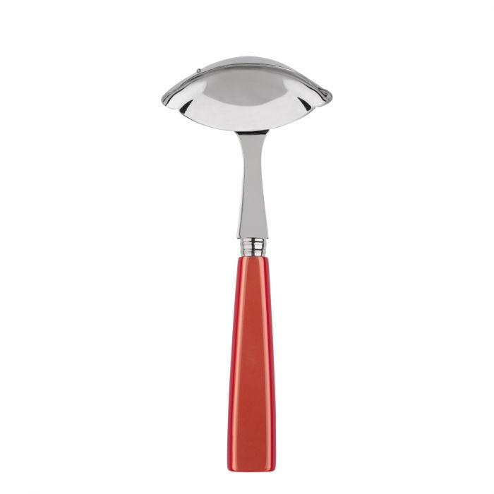 Stainless steel gravy ladle with a curved bowl and a vibrant red handle, designed for serving sauces and gravies.