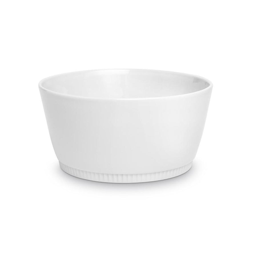 White Pillivuyt Toulouse medium souffle dish with a smooth, curved design and ribbed base, ideal for baking.