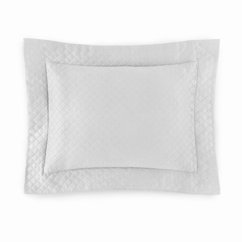 Sferra Bari Pillow Shams in a soft gray color with a quilted diamond pattern, featuring a smooth, elegant finish.