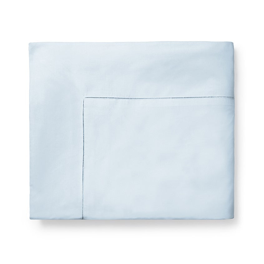 Sferra Celeste duvet cover in soft blue with a subtle hemstitch detail, offering a serene and elegant bedding option.