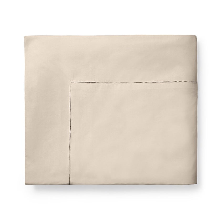 Sferra Celeste Duvet Cover in a soft beige color, featuring a clean design with subtle stitching detail.