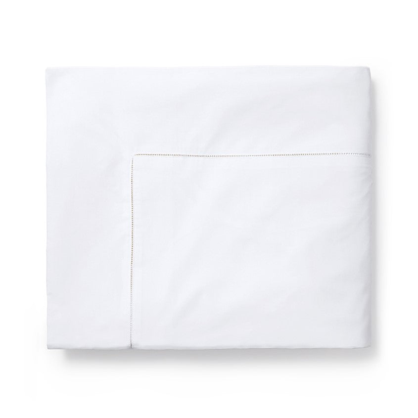 Sferra Celeste duvet cover in crisp white with subtle stitching detail, perfect for elegant bedroom decor.
