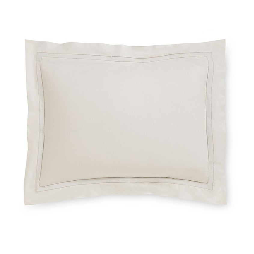 Sferra Finna Pillow Sham in soft beige with a subtle stitched border, adding elegance to bedding decor.