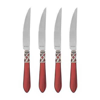 Set of four Vietri Aladdin Antique steak knives featuring stainless steel blades and red handles with intricate detailing.