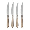 Set of four Vietri Aladdin Antique steak knives featuring serrated blades and elegant decorative handles.