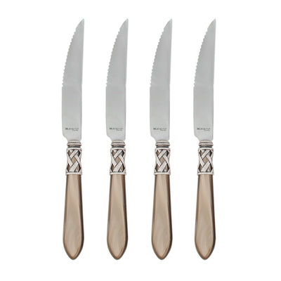 Set of four Vietri Aladdin Antique steak knives featuring serrated blades and elegant decorative handles.