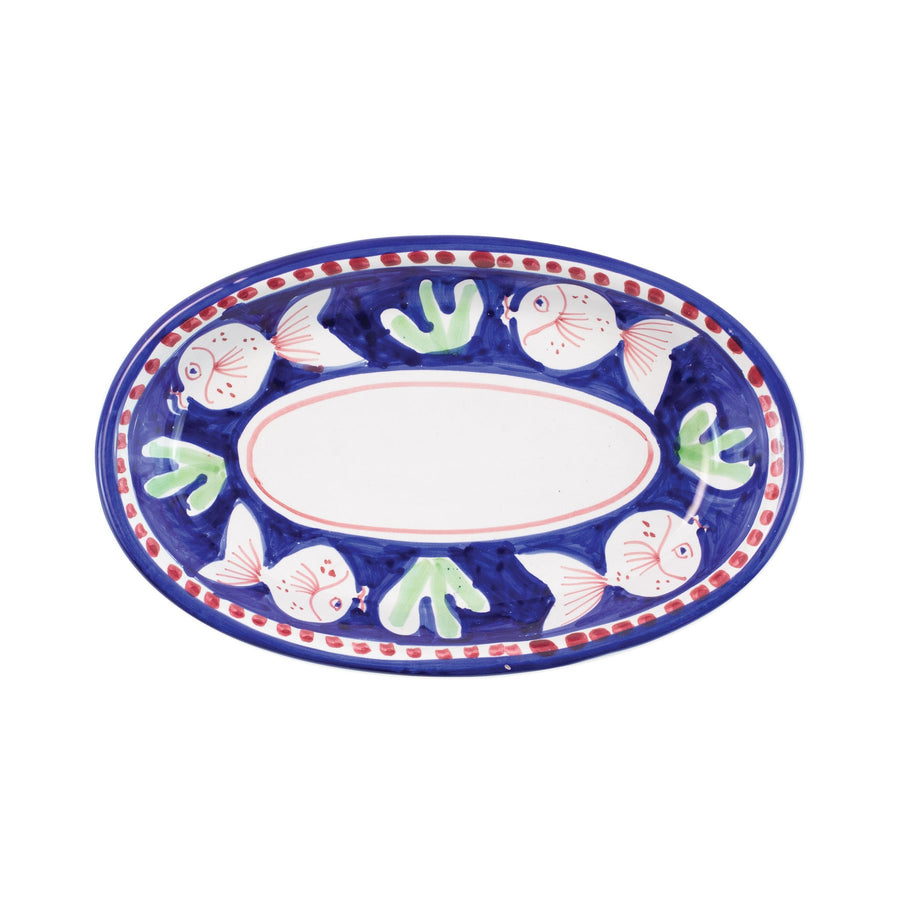 Vietri Campagna Pesce small oval tray featuring colorful fish and green seaweed designs on a blue background.